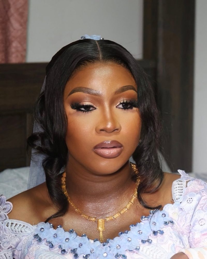 Naming ceremony look: sculpted brows, soft glam and a gold necklace